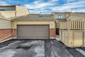 Garage with asphalt driveway