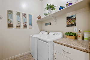 Washroom with separate washer and dryer and cabinet space