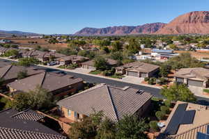 Aerial perspective of suburban area with a mountainous background