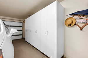 Hall with concrete flooring and a textured ceiling
