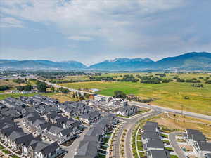 Aerial view of residential area featuring a mountainous background