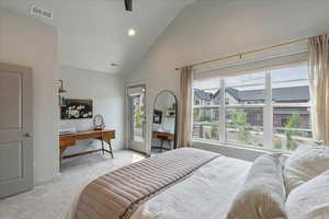 Bedroom featuring access to exterior, recessed lighting, light colored carpet, a ceiling fan, and high vaulted ceiling