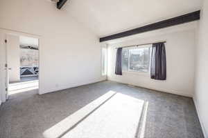 Upstairs Family room with beamed ceiling, carpet flooring, and high vaulted ceiling