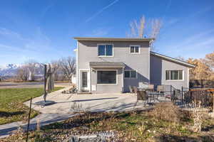 Rear view of property with a patio area and a mountain view
