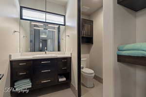 Bathroom with vanity and light tile patterned floors