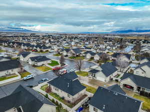 Aerial perspective of suburban area with a mountain backdrop