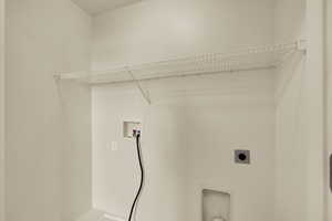 Laundry room with washer hookup and electric dryer hookup