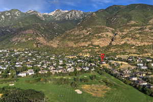 Mountain view featuring nearby suburban area and a golf club