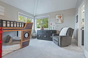 Carpeted bedroom with baseboards