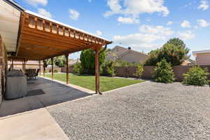 Fenced backyard featuring a patio area