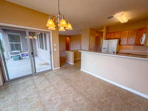 Kitchen bar and exterior exit to backyard patio