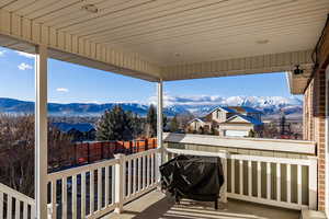 Wooden terrace with a mountain view and grilling area