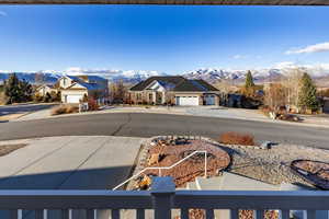 View of road featuring a mountain view, a residential view, and sidewalks
