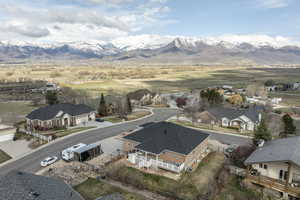 Aerial perspective of suburban area featuring a mountain backdrop