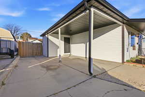 View of side of home with a patio area