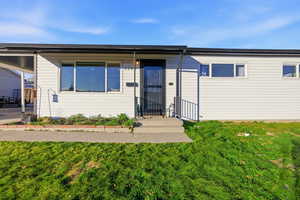 View of front of house with a front lawn