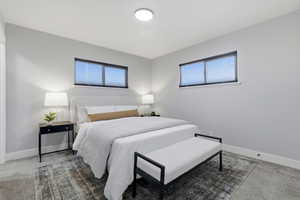 Primary Bedroom with En-Suite. Carpeted bedroom featuring multiple windows