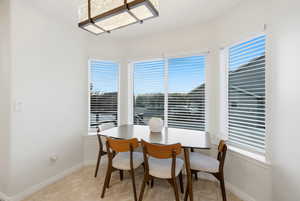 Dining room featuring healthy amount of natural light and light tile patterned floors