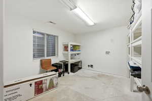 Miscellaneous room with concrete floors