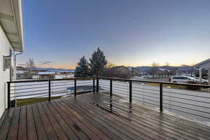 Deck at dusk with a residential view