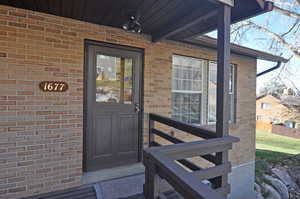 Property entrance with brick siding