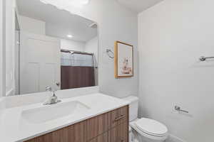 Bathroom featuring vanity and curtained shower