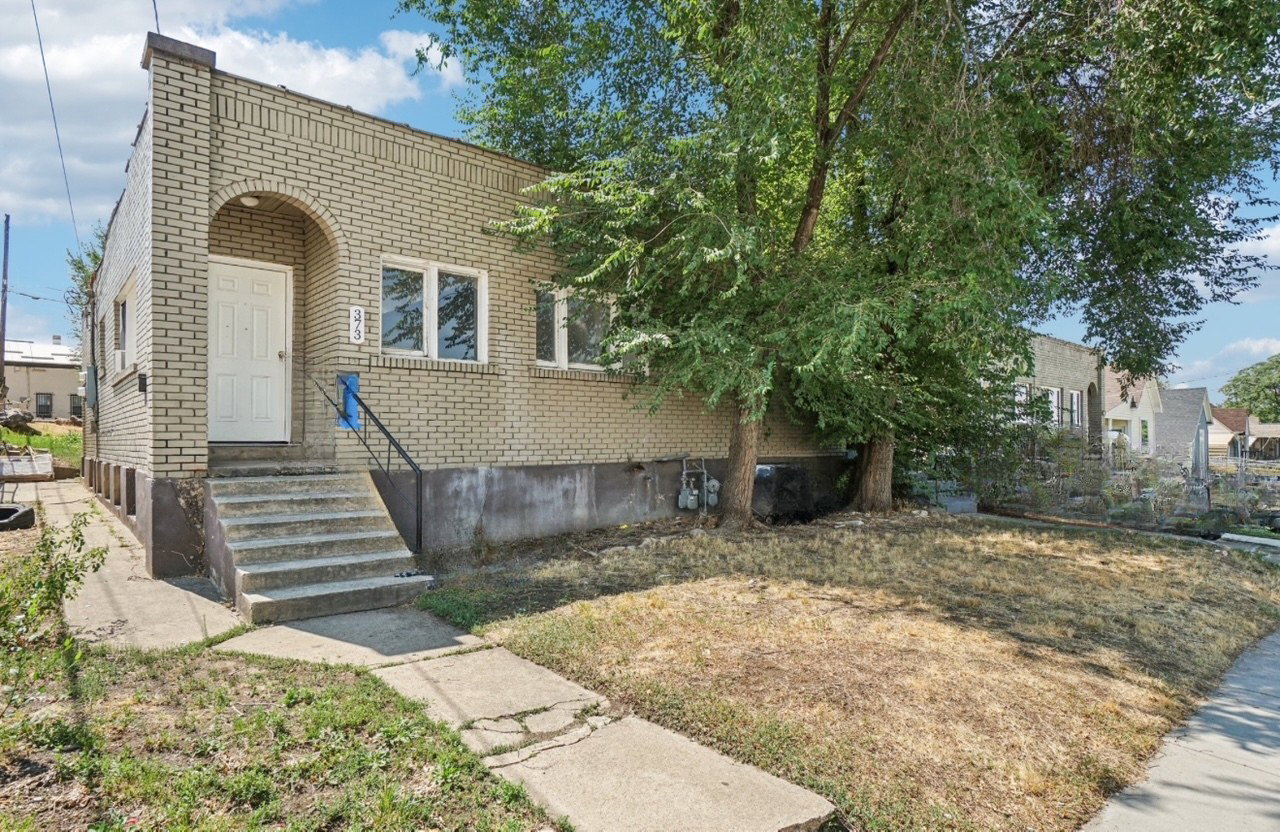 View of front of property with brick siding