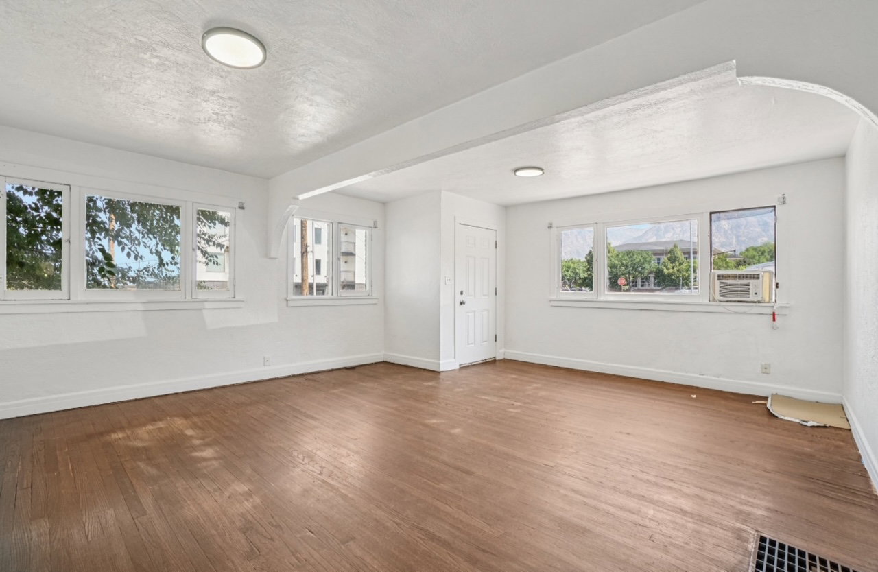 Foyer entrance featuring wood finished floors and a textured ceiling