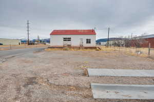View of property with a mountain view and a pole building