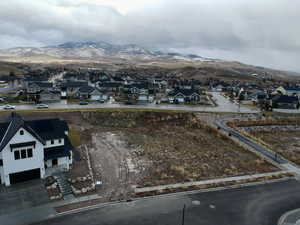 Aerial perspective of suburban area featuring a mountainous background
