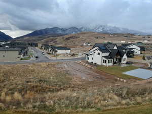 Aerial perspective of suburban area with a mountainous background
