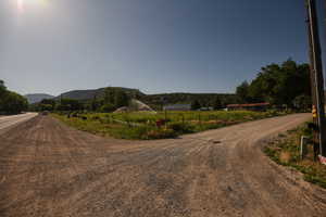 View of road with a rural view and a mountain view