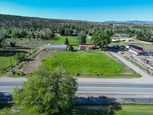 Aerial view of sparsely populated area with a mountain backdrop