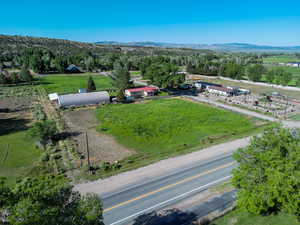 Overview of rural landscape featuring a mountainous background