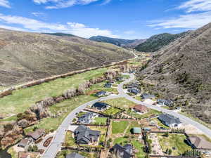 Aerial perspective of suburban area with a mountain backdrop
