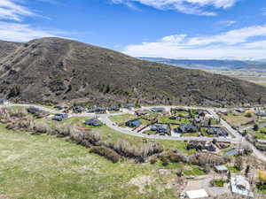 Aerial perspective of suburban area featuring a mountainous background