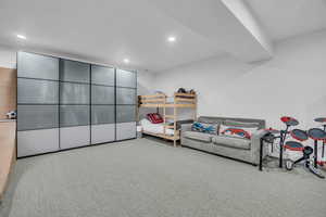 Bedroom with carpet floors and recessed lighting