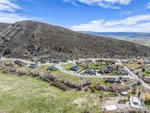 Aerial view of residential area with a mountainous background