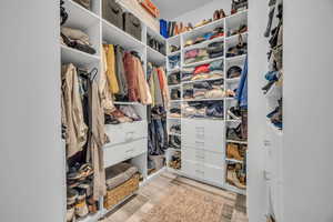 Walk in closet featuring light wood finished floors