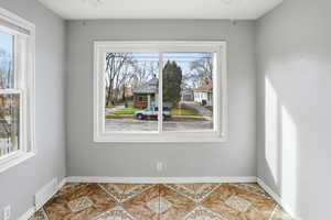 Dining area featuring baseboards and light tile patterned floors