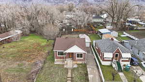 Aerial perspective of suburban area featuring a mountain backdrop