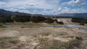 View of mountain backdrop featuring rural landscape