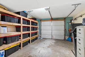 Garage featuring a garage door opener
