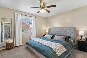 Bedroom featuring carpet flooring and a ceiling fan