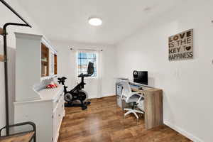 Office with baseboards and dark wood finished floors