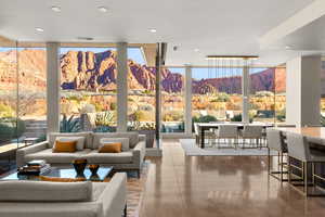 Common area with a mountain view, recessed lighting, and a wall of windows