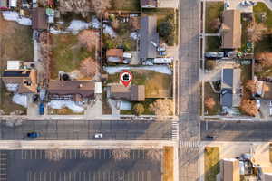 Aerial view of property's location with nearby suburban area
