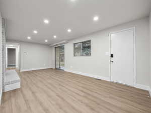 Unfurnished living room with recessed lighting and light wood-style floors