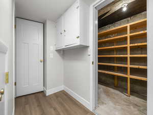 Washroom featuring baseboards and light wood-type flooring