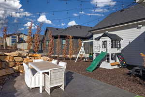 View of patio / terrace with outdoor dining area and a playground